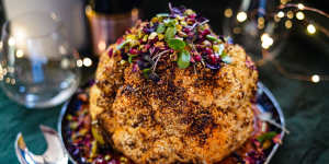 Christmas centrepiece:Whole-roasted spice-rubbed cauliflower sitting on romesco.