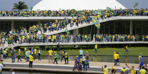 Protesters,supporters of Brazil’s former President Jair Bolsonaro,storm the National Congress building in Brasilia on January 8,a week after his sucessor Luis Inacio Lula da Silva,took office.