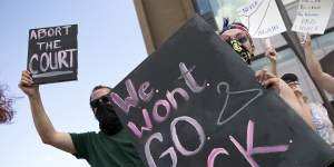 Charlie Wayne,left,Jasper Nieves and other demonstrators advocate for a woman’s right to an abortion in Roanoke,Virginia.