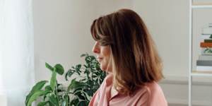 Stock image shows a woman working from home,which the Fair Work Commission ruled was acceptable in this case.