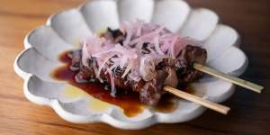 Skewers of wagyu rump cap teriyaki-glazed and topped with pickled shallots.