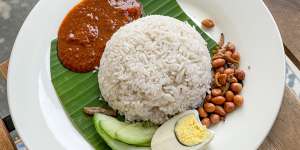 Breakfast of champions … Nasi lemak,Malaysian coconut milk rice,served with egg,sambal,fried crispy anchovies,toasted peanuts and cucumber.