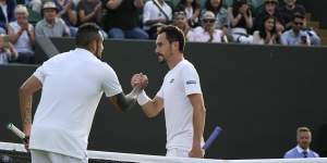 Nick Kyrgios shakes hands with Italy’s Gianluca Mager after their match.