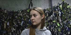 Tetiana Onopriienko 16 years old in her last year of high school is now volunteering to make camouflage nets in a community shelter in Uman.