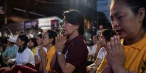 People pray during the commemoration ceremony of the 20th anniversary of the attack in Bali that killed 88 Australians. 