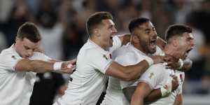 Dominant:England celebrate their upset over New Zealand at International Yokohama Stadium.