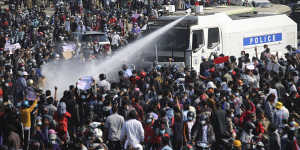 Police spray water cannon on a crowd in Nay Pyi Taw on February 8.