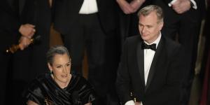 Emma Thomas and Christopher Nolan accept the best picture award.