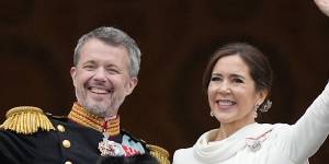 Denmark’s King Frederik X and Queen Mary wave from the balcony of Christiansborg Palace in Copenhagen,Denmark.