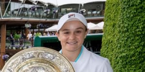 Ash Barty celebrates after winning the 2021 Wimbledon crown by beating Karolina Pliskova.