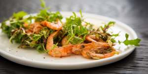 Grilled Hawkesbury school prawns served with rocket leaves,flowers,garlicky aioli and espelette pepper.