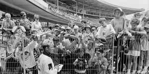 Shane Warne signs autographs during Victoria’s Sheffield Shield match against New South Wales at the SCG in December 1993.
