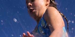 Swimmers enjoy warm weather in Sydney in August 2025. 