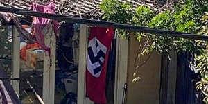 The NSW government is looking to ban Nazi flags after a swastika was flown on a Newtown house at the weekend. 