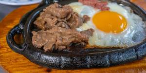 Vietnamese steak and eggs,known as “bo ne” or “dodging beef”.