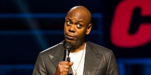 Dave Chappelle on stage performing his Netflix special,The Closer.
