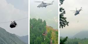 A Pakistani military helicopter rescued two of seven children trapped with their teacher in a cable car dangling over a high ravine earlier on Tuesday.