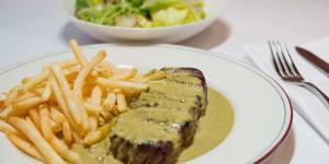 Signature dish:Steak,green salad with dijon vinaigrette and bottomless fries.