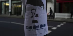 A placard featuring Chinese President Xi Jinping,is displayed near the Chinese embassy in London.