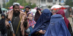 Taliban order Afghan women to cover up head to toe