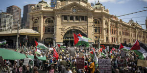 Pro-Palestine protesters outside Flinders Street Station in Melbourne on Sunday.