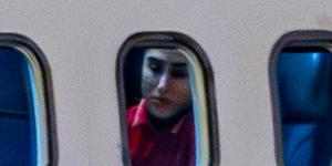 The team visible through their plane windows after landing in Sydney.