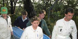 Rescue workers remove the body of a female British backpacker after it was discovered in the Belanglo State forest in 1992.