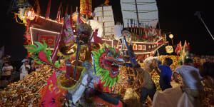 Ethnic Chinese devotees prepare a Wangkang ship during night culminating in a send-off ceremony.