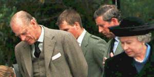 (L-R) Prince Harry,Prince William,Prince Phillip,Peter Phillips,Prince Charles and Queen Elizabeth II look at flowers and cards laid at the gates of Balmoral on September 4,1997. 