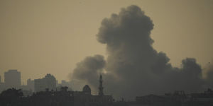 Smoke rises following an Israeli airstrike in the Gaza Strip,as seen from southern Israel.