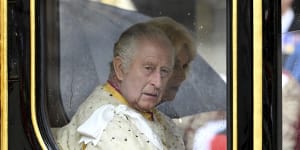 A lip reader says Charles grumbled to Camilla after his carriage arrived early.