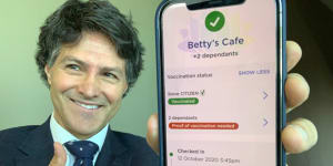 NSW Customer Service Minister Victor Dominello displays the check-in app.