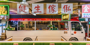 Traffic signs and a minibus recreate a streetscape at Kowloon Cafe in Burwood.