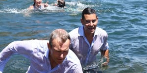 NSW Cities Minister Rob Stokes and member for Sydney Alex Greenwich take a plunge at Marrinawi Cove.