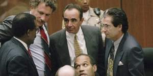 O.J. Simpson is surrounded by his lawyers (clockwise from left) Johnnie L. Cochran Jr,Peter Neufeld,Robert Shapiro,Robert Kardashian and Robert Blasier.