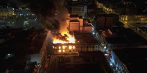 A building burns amid anti-government protests in downtown Lima,Peru,on Thursday.