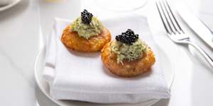 Sabudana vada,an Indian potato and tapioca fritter,topped with crab.