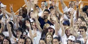 Serbia's Novak Djokovic,centre,poses with volunteers and players after the tournament in Belgrade on June 14.