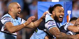 Oh we’re the real deal,baby. Cronulla celebrate a try against Canberra.