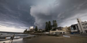 A storm rolls into Cronulla beach,where the Reserve Bank expects climate change is