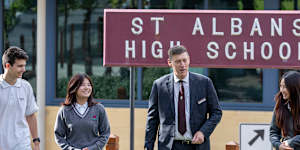 St Albans Secondary College students Mitchell Cauchi,Stephanie Truong and Josephine Mai with principal Craig Jennings.