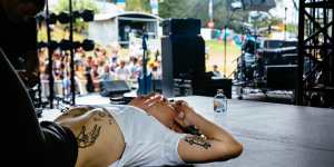 Maq onstage with Camp Cope at Laneway 2017.