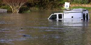 A utility vehicle is partially submerged in Santa Cruz,California,on Saturday (Sunday Australian time).
