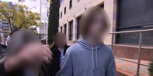 The teenager leaving Perth Children’s Court with his family on Wednesday. 
