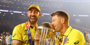 Glenn Maxwell and David Warner with the 50-over World Cup trophy,which Australia held aloft in India in November.