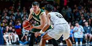 Dejan Vasiljevic of the Boomers looks to pass defended by Shea Ili of the Tall Blacks during the Trans-Tasman Throwdown opening match.