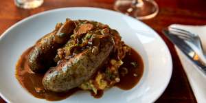 Bangers and mash (pork and fennel sausages with colcannon,caramelised onions and red wine sauce).
