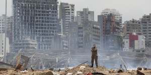 A soldier stands at the devastated site of the explosion in the Port of Beirut,Lebanon.