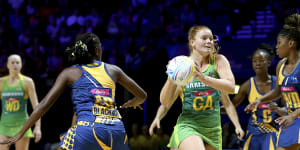 Steph Wood (centre),pictured here in action at last year's Netball World Cup,was crucial in the Lightning's win.