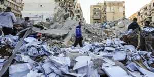 Documents of Hezbollah-run al-Qard al-Hassan are scattered at the site of an Israeli airstrike on Sunday night in Beirut’s southern suburb,Lebanon.